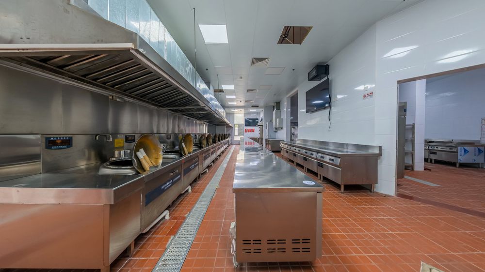 Commercial kitchen with a stainless-steel cooking line